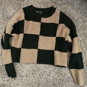 Never warn checkered sweater